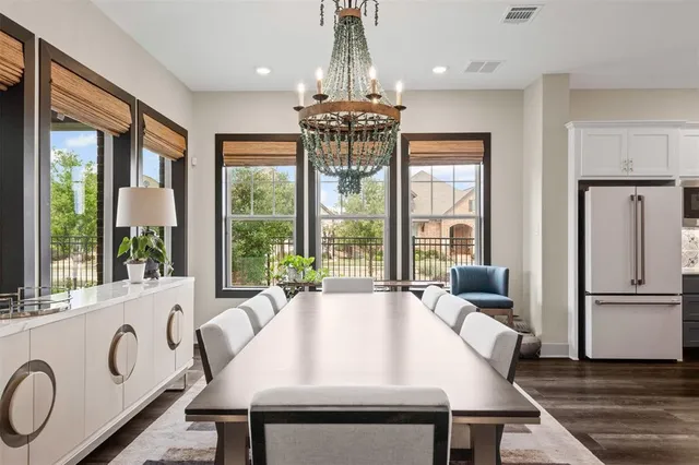 a very nice looking dining room with a large window
