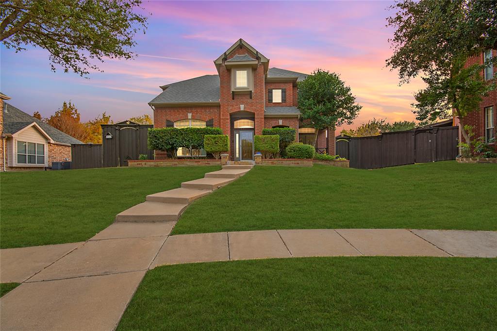11601 Forestbrook Drive Frisco, TX 75035 - Photo 1 of 40 a front view of a house with a yard