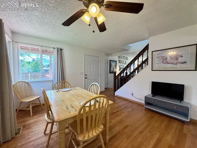 a workspace with furniture window and wooden floor