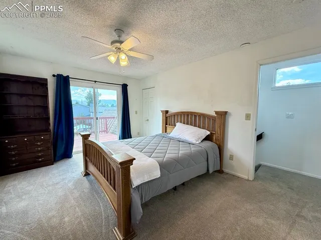 a bedroom with a bed and a television