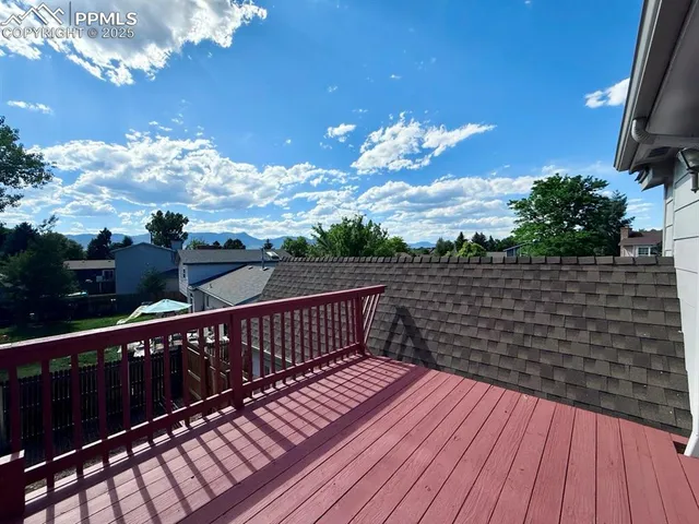 a view of a balcony with wooden floor