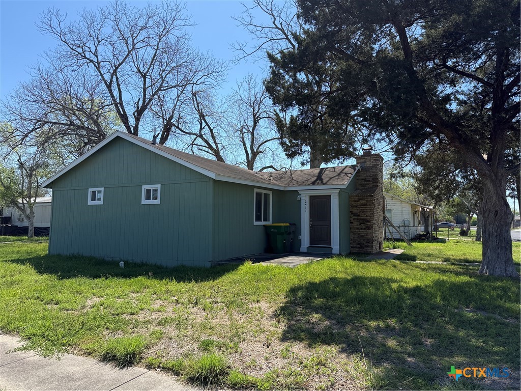 2411 Mumphord Street Victoria, TX 77901 - Photo 12 of 17 a view of a house with yard and a tree