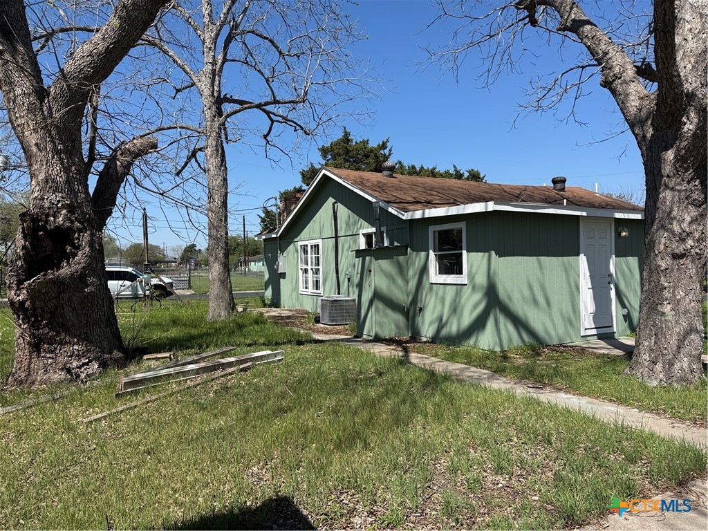 2411 Mumphord Street Victoria, TX 77901 - Photo 14 of 17 a view of a house with backyard and a tree