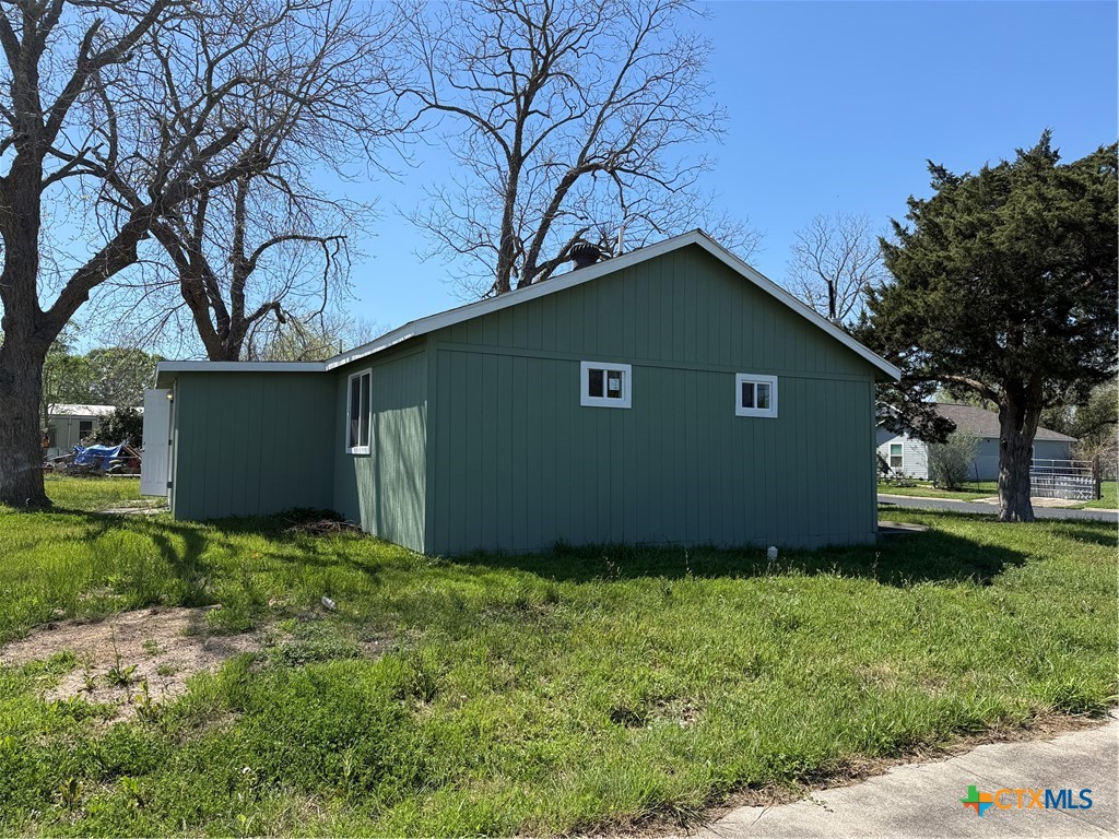 2411 Mumphord Street Victoria, TX 77901 - Photo 16 of 17 a house is sitting in middle od the grass
