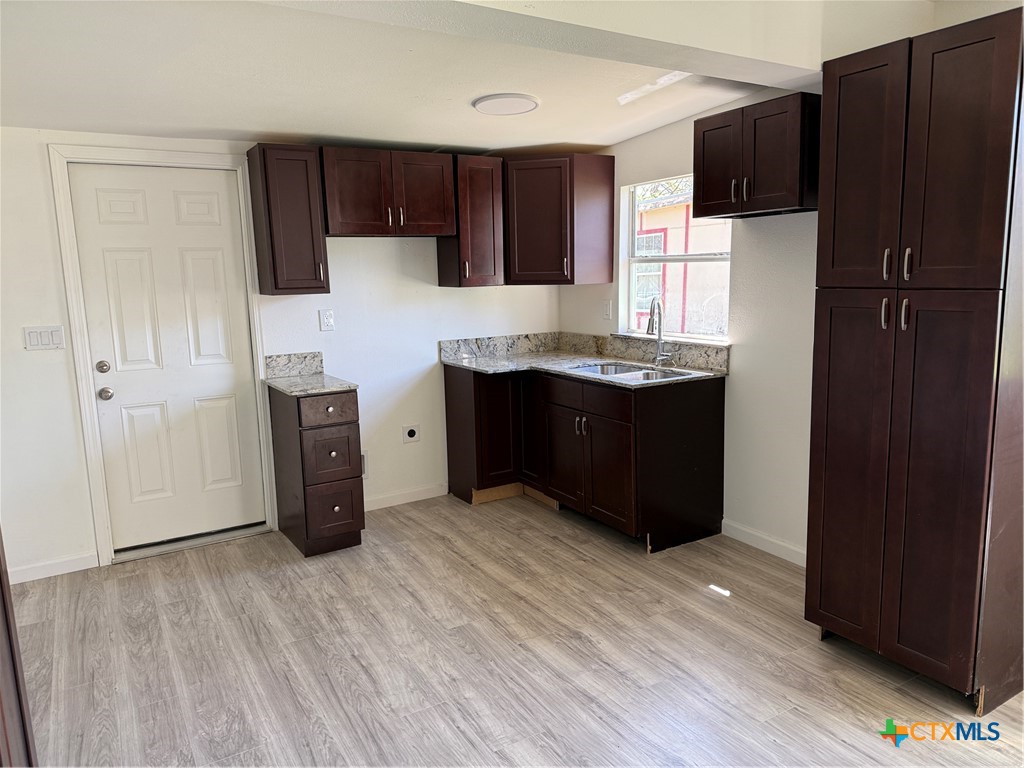 2411 Mumphord Street Victoria, TX 77901 - Photo 2 of 17 a kitchen with stainless steel appliances a refrigerator and a stove top oven