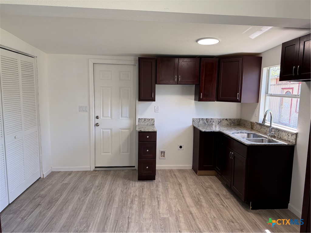 2411 Mumphord Street Victoria, TX 77901 - Photo 3 of 17 a kitchen with a refrigerator and a stove top oven