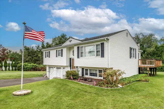 a house view with a sitting space and garden space
