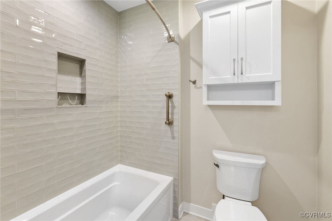 13500 Stonegate Road Midlothian, VA 23113 - Photo 33 of 47 a white toilet sitting next to a bath tub