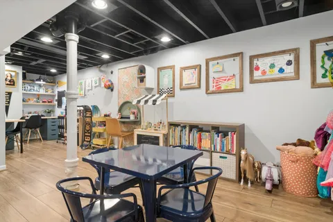 a view of a dining room with furniture and a table