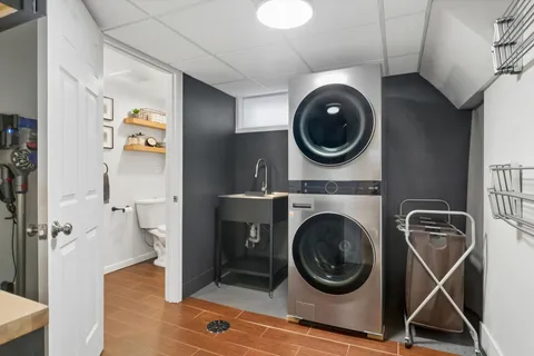 a close view of a utility room with dryer and washer