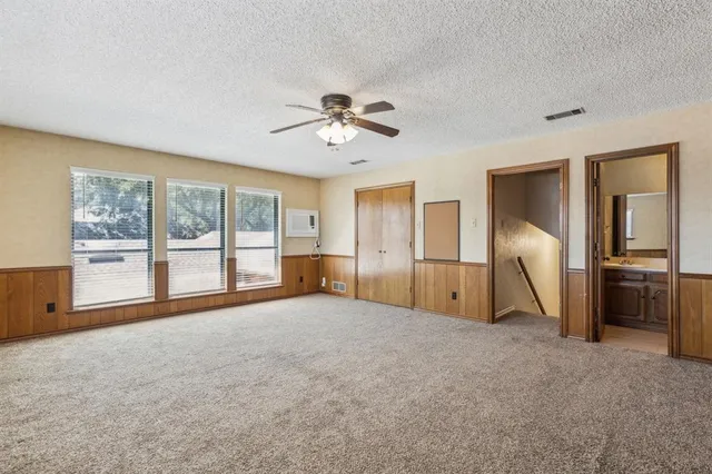 a view of an empty room with a fireplace