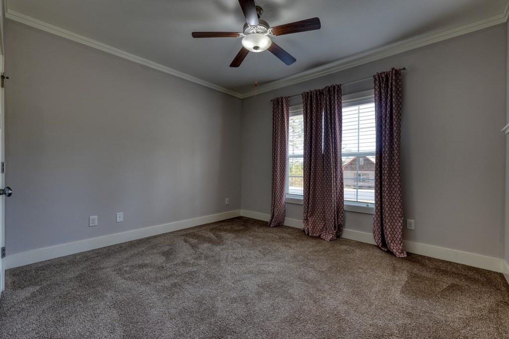 161 Loop Lane Blairsville, GA 30512 - Photo 22 of 67 an empty room with chandelier fan and windows