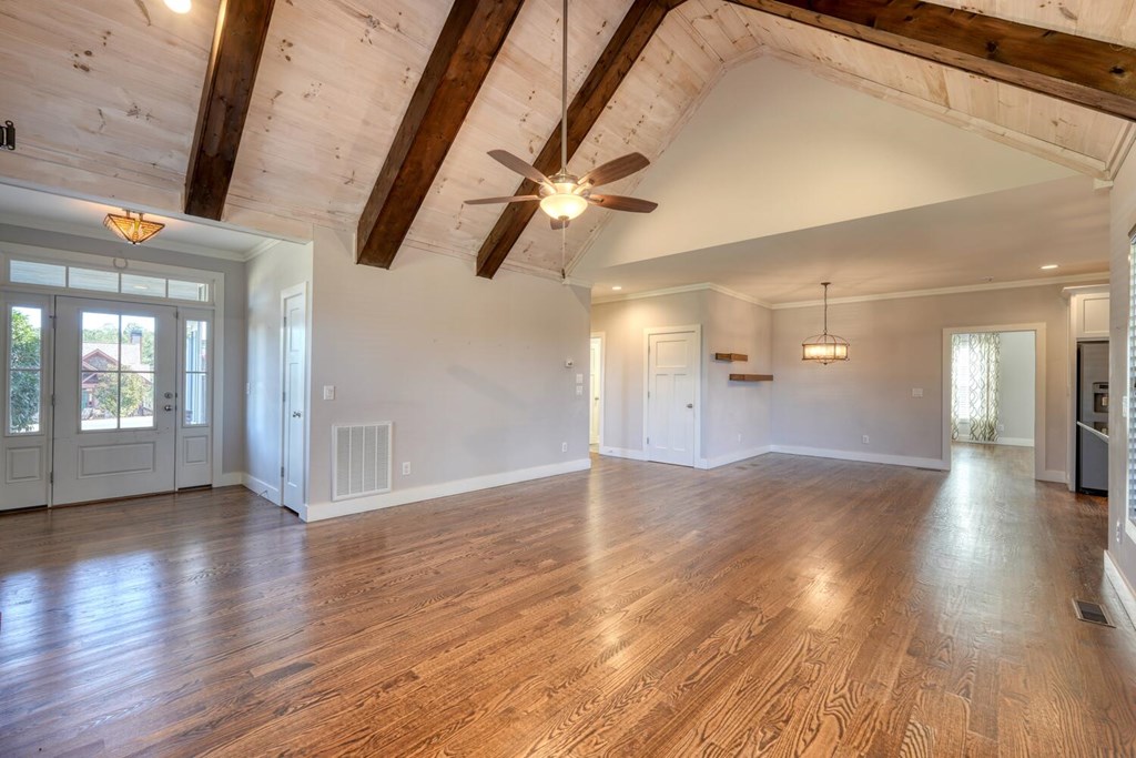 161 Loop Lane Blairsville, GA 30512 - Photo 4 of 67 a view of an empty room with window and wooden floor