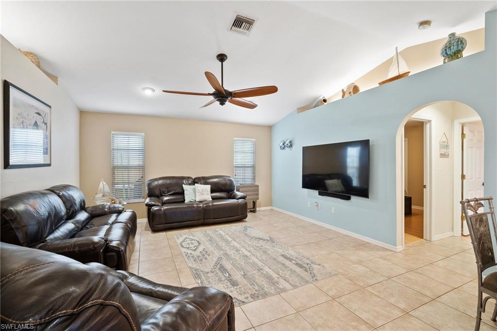 9144 Aster Road Fort Myers, FL 33967 - Photo 18 of 42 a living room with furniture and a flat screen tv