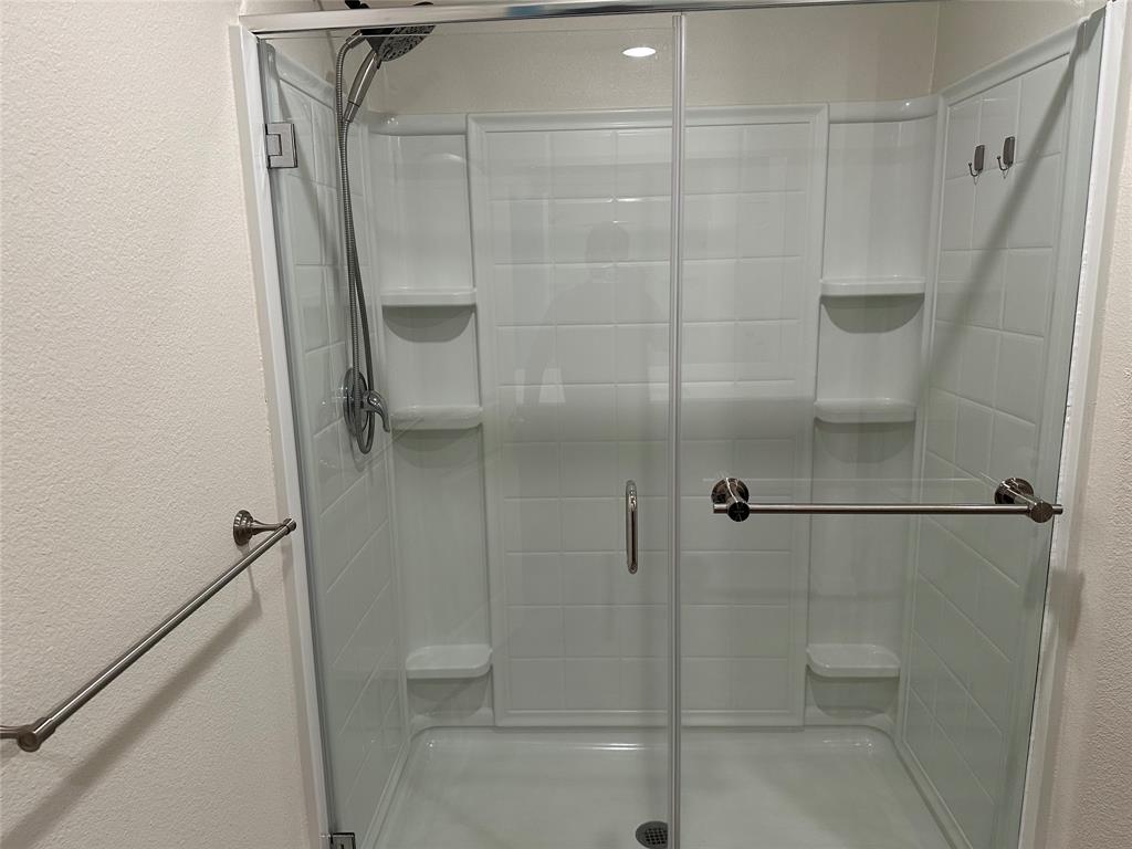 13624 Mineral Road Ponder, TX 76259 - Photo 18 of 26 Full bathroom with a shower stall and a textured wall
