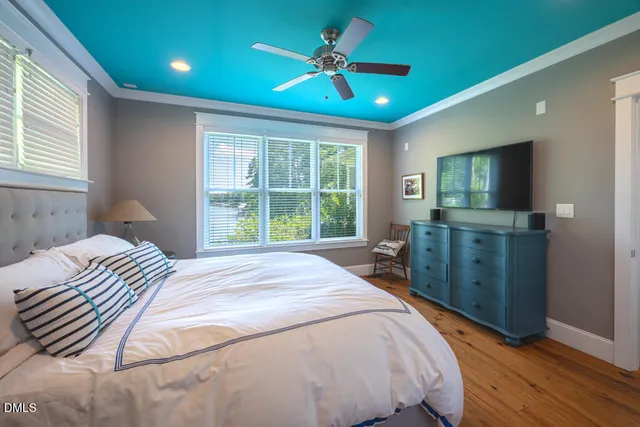 a bathroom with a granite countertop sink a mirror and a shower