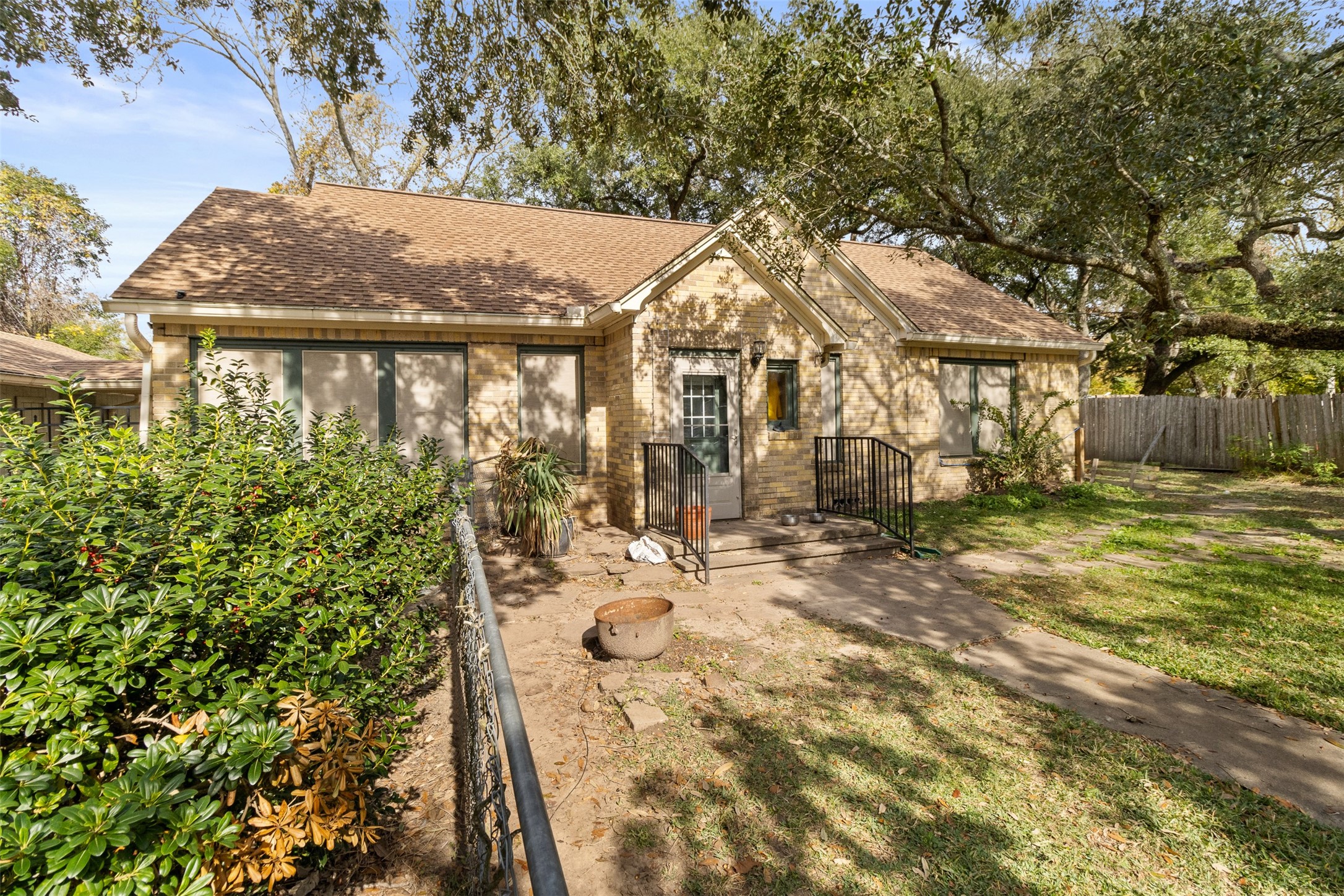 205 Jephson Street Alvin, TX 77511 - Photo 1 of 40 a view of a white house with a yard