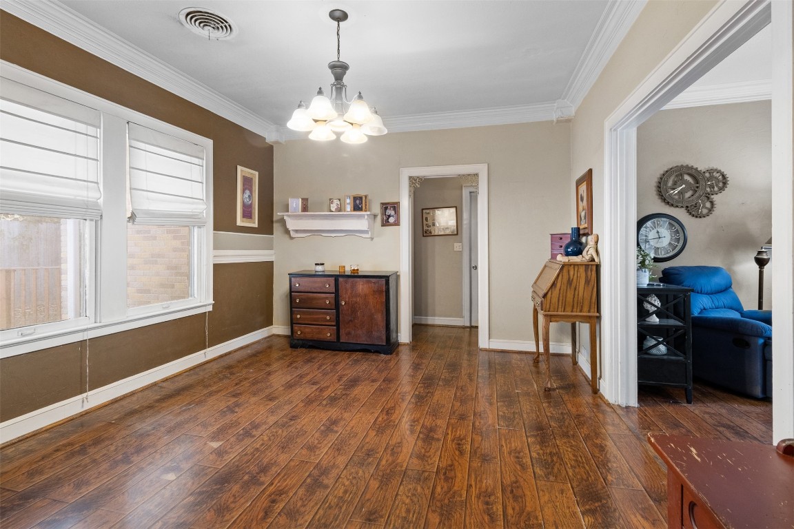 205 Jephson Street Alvin, TX 77511 - Photo 17 of 40 a view of a kitchen with cabinets and wooden floor