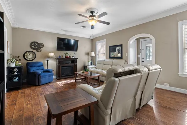 a living room with furniture fireplace and a flat screen tv