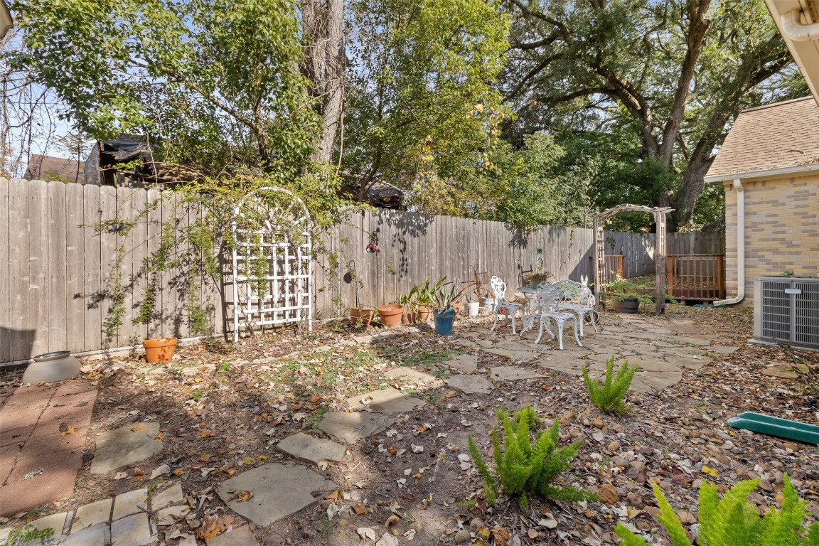 205 Jephson Street Alvin, TX 77511 - Photo 24 of 40 a view of a backyard with trees