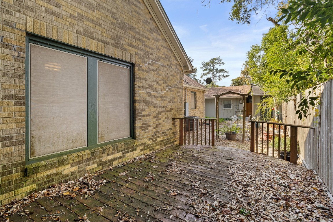205 Jephson Street Alvin, TX 77511 - Photo 37 of 40 a view of a house with a wooden fence