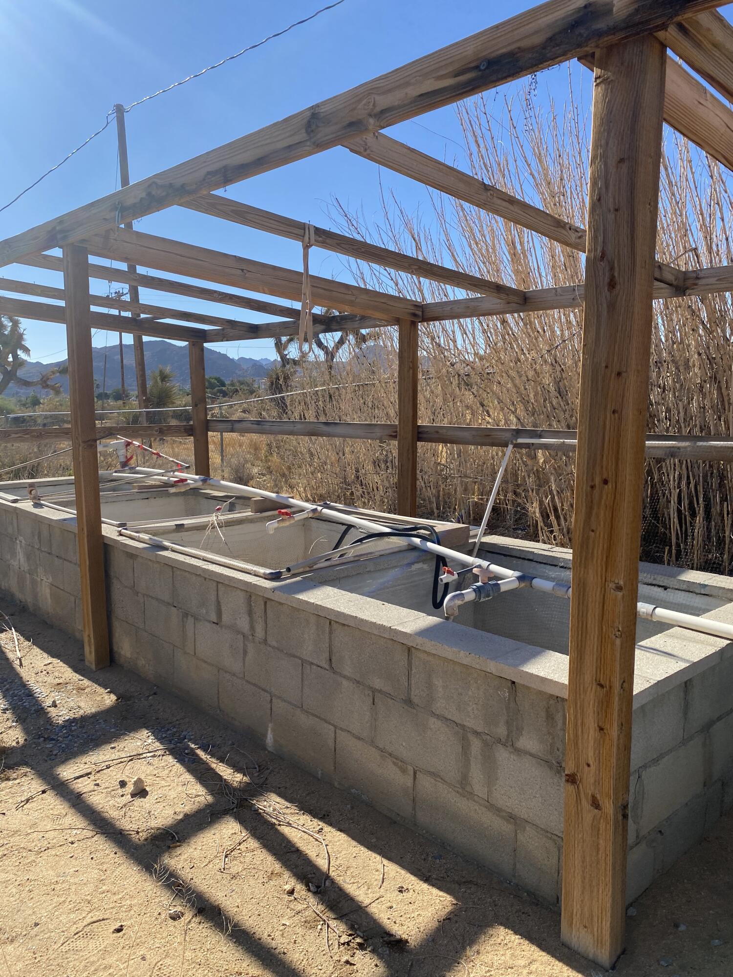 6784 Outpost Road Joshua Tree, CA 92252 - Photo 20 of 22 a room with storage and utility