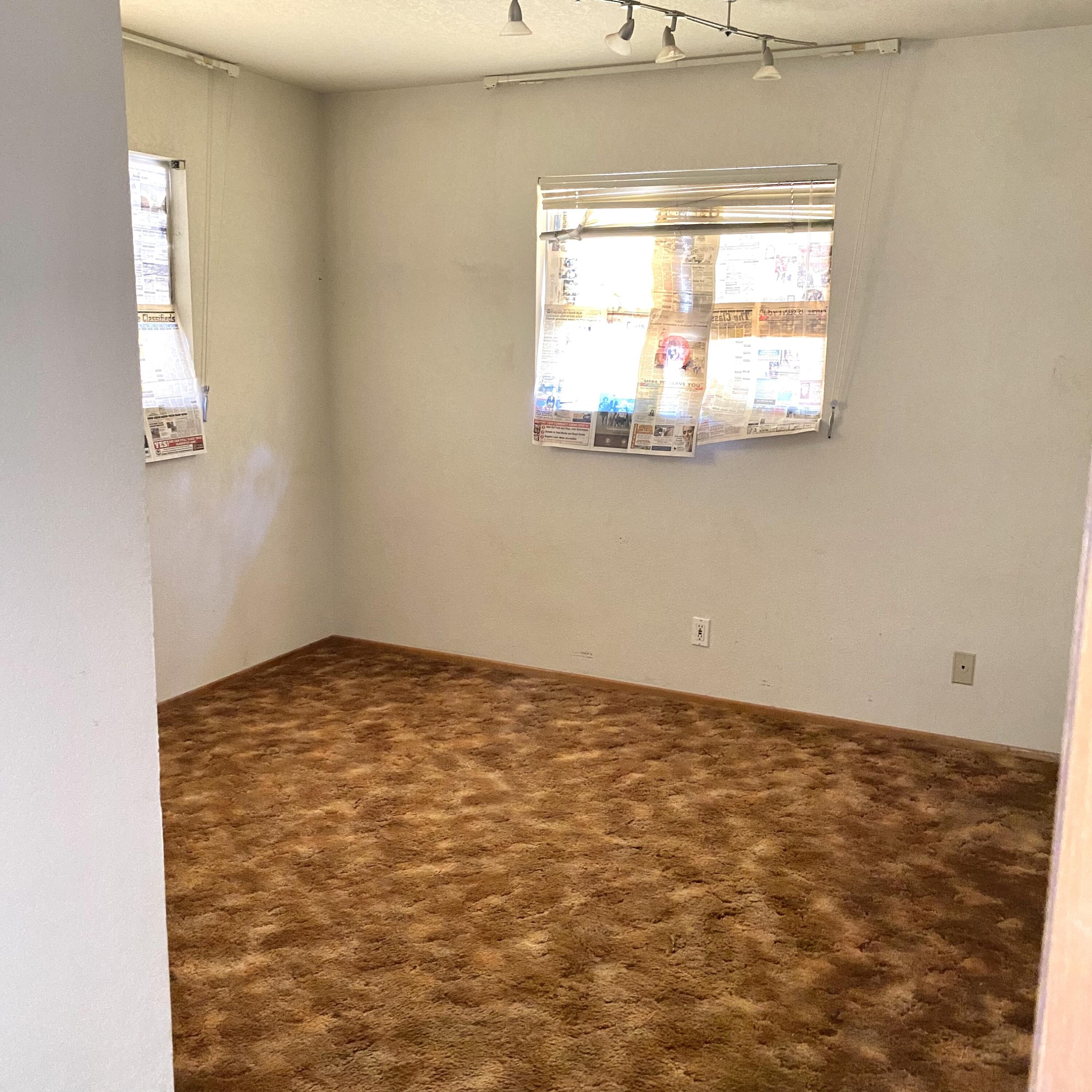 6784 Outpost Road Joshua Tree, CA 92252 - Photo 7 of 22 an empty room with a window