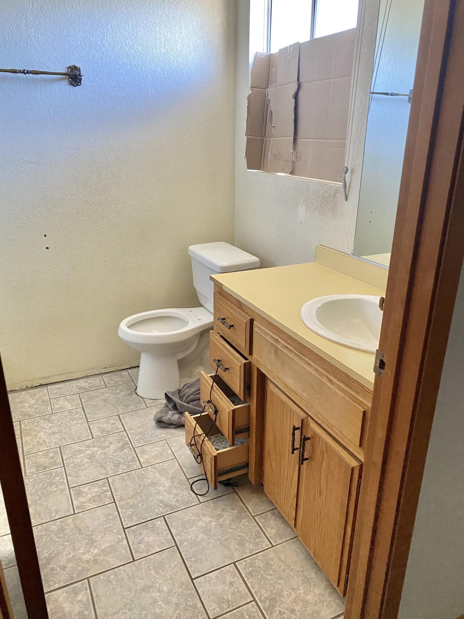 6784 Outpost Road Joshua Tree, CA 92252 - Photo 8 of 22 a bathroom with a sink toilet and vanity