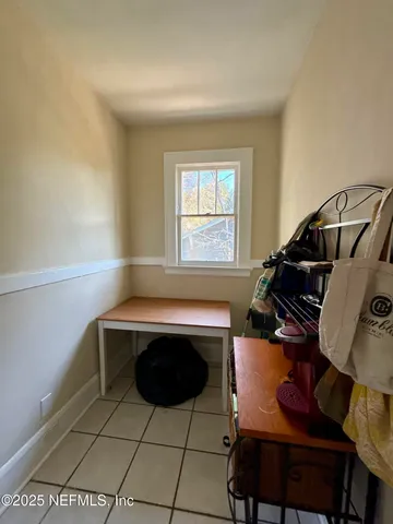 a view of workspace with furniture and window