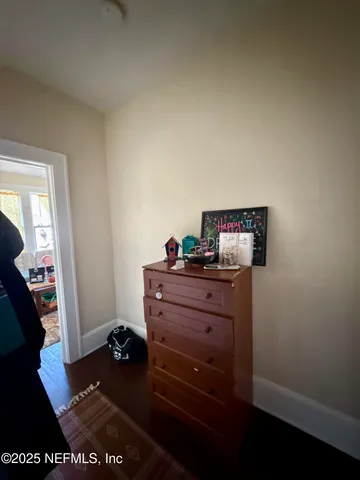 a room with furniture and wooden floor