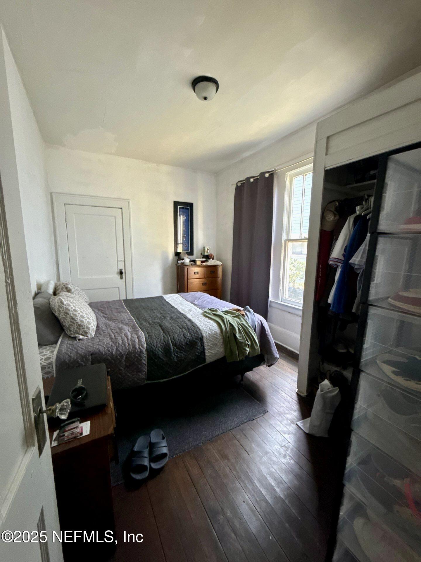 2850 Post Street Jacksonville, FL 32205 - Photo 5 of 20 a bedroom with a bed and wooden floor