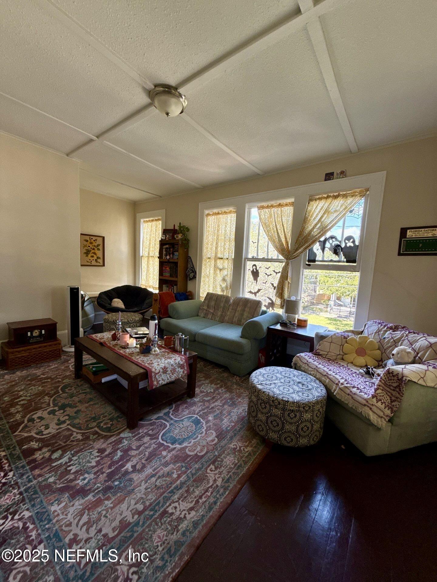 2850 Post Street Jacksonville, FL 32205 - Photo 6 of 20 a living room with furniture ceiling fan and a window