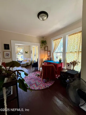a living room with furniture and a window