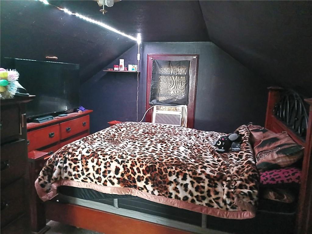 1013 Henry Street Rostraver Township, PA 15012 - Photo 23 of 46 a bed sitting in a bedroom next to a window