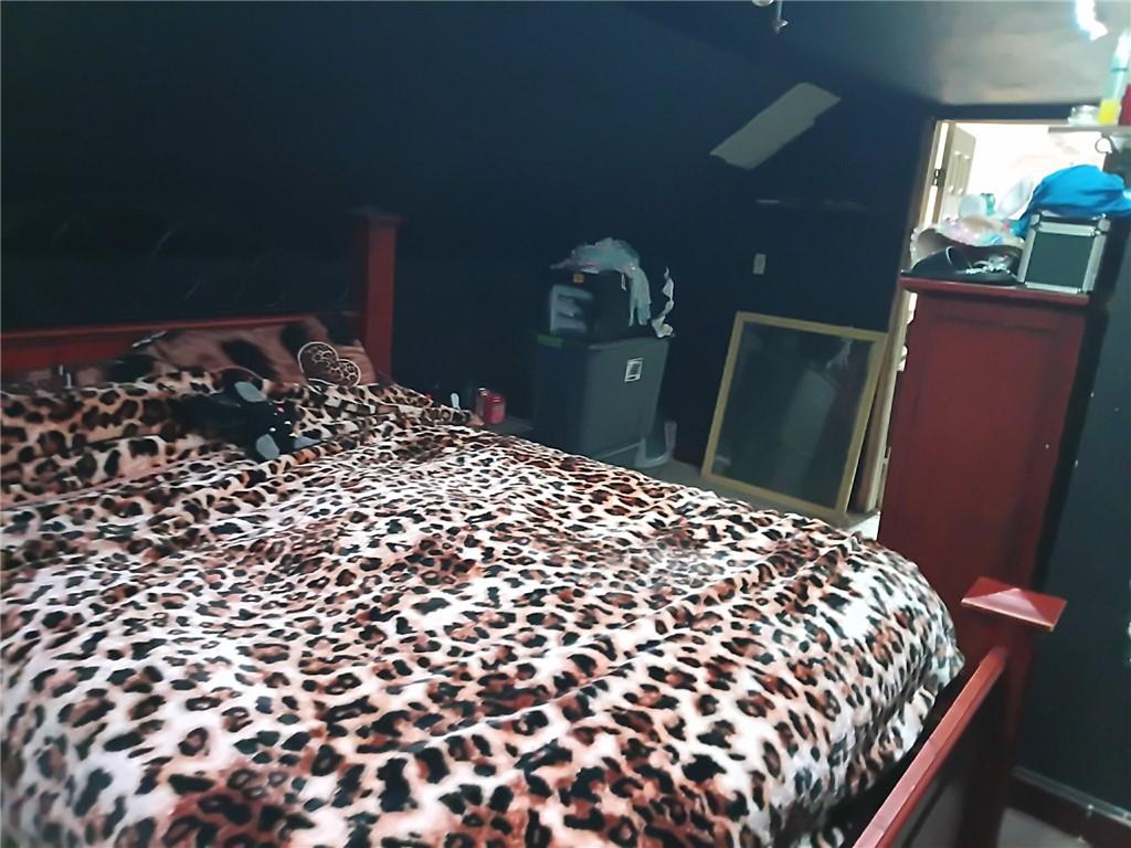 1013 Henry Street Rostraver Township, PA 15012 - Photo 24 of 46 a large bed sitting in a bedroom next to a lamp