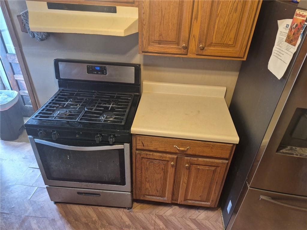 1013 Henry Street Rostraver Township, PA 15012 - Photo 32 of 46 a stove top oven sitting inside of a kitchen