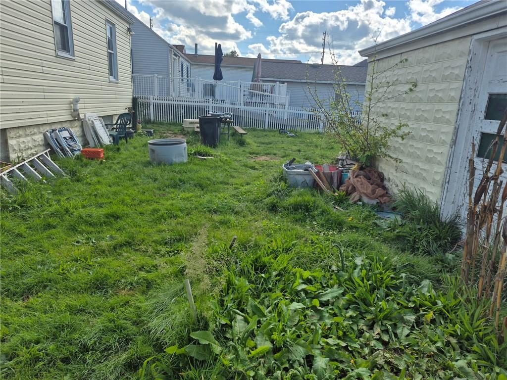 1013 Henry Street Rostraver Township, PA 15012 - Photo 43 of 46 a view of a backyard with plants and a patio