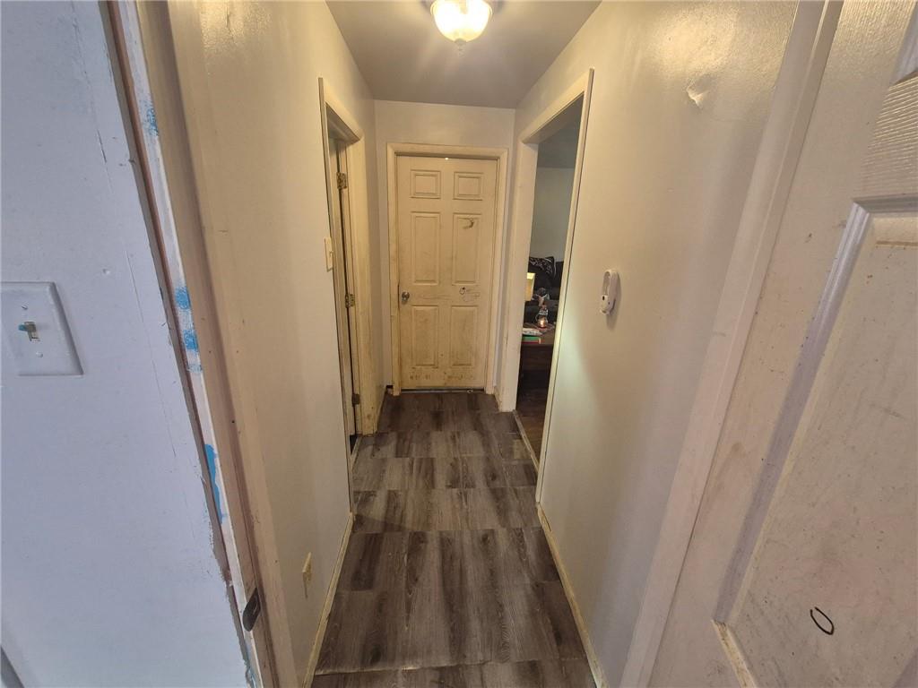 1013 Henry Street Rostraver Township, PA 15012 - Photo 7 of 46 a view of a hallway with wooden floor and staircase
