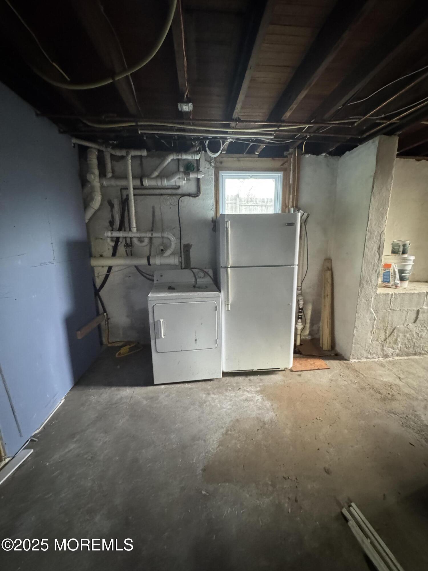 259 Matawan Avenue, Unit 2 Matawan, NJ 07747 - Photo 18 of 18 a view of empty room with washer and dryer