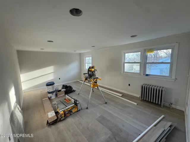 a room with gym equipment and a window
