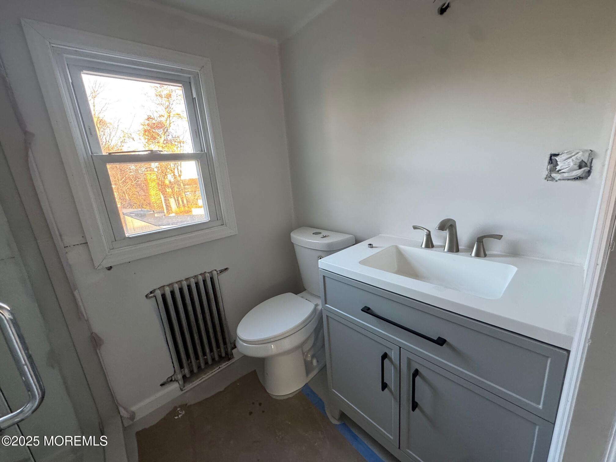 259 Matawan Avenue, Unit 2 Matawan, NJ 07747 - Photo 5 of 10 a bathroom with a sink toilet and window