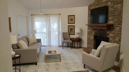 34 Green Bough Court The Woodlands, TX 77380 - Photo 6 of 22 a living room with furniture and a fireplace