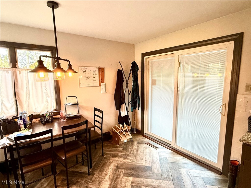 4930 Kirk Road Austintown, OH 44515 - Photo 8 of 17 Dining space with dark parquet flooring