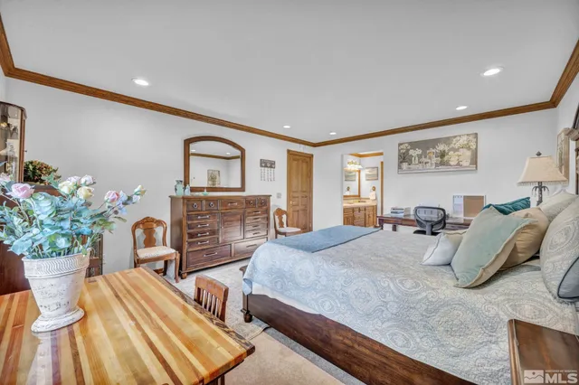a spacious bathroom with a sink double vanity and a mirror