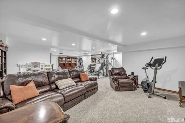 a view of a patio with couches and table and chairs and potted plants