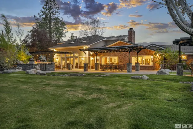 a view of a patio with a dining table and chairs