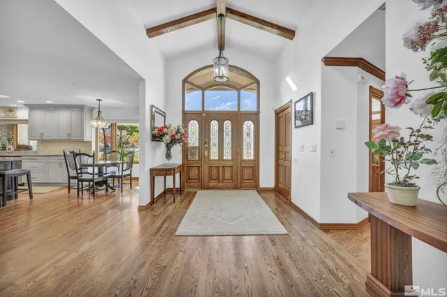 a view of a livingroom with furniture and hardwood floor