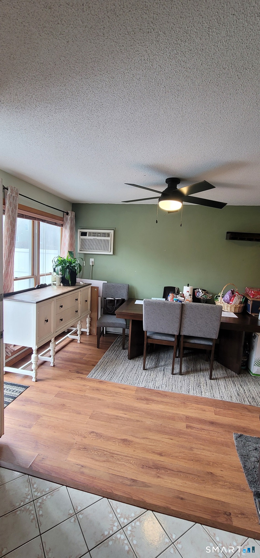 40 South Street, Unit 25 Bristol, CT 06010 - Photo 12 of 24 a living room with furniture a pool table and a large window
