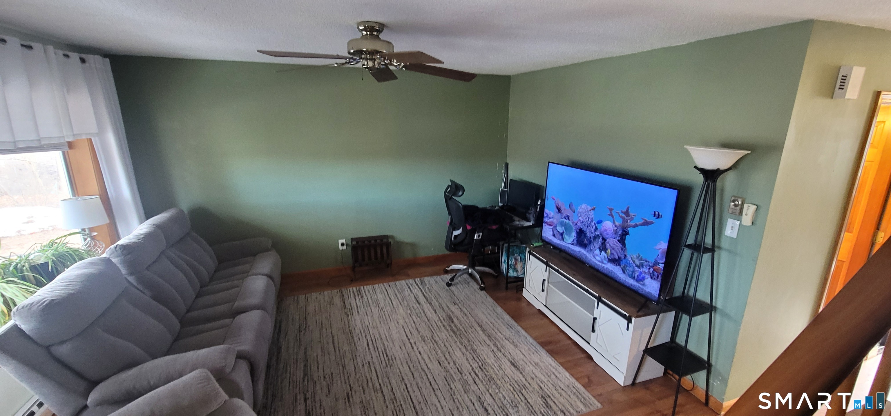 40 South Street, Unit 25 Bristol, CT 06010 - Photo 13 of 24 a living room with furniture and a flat screen tv