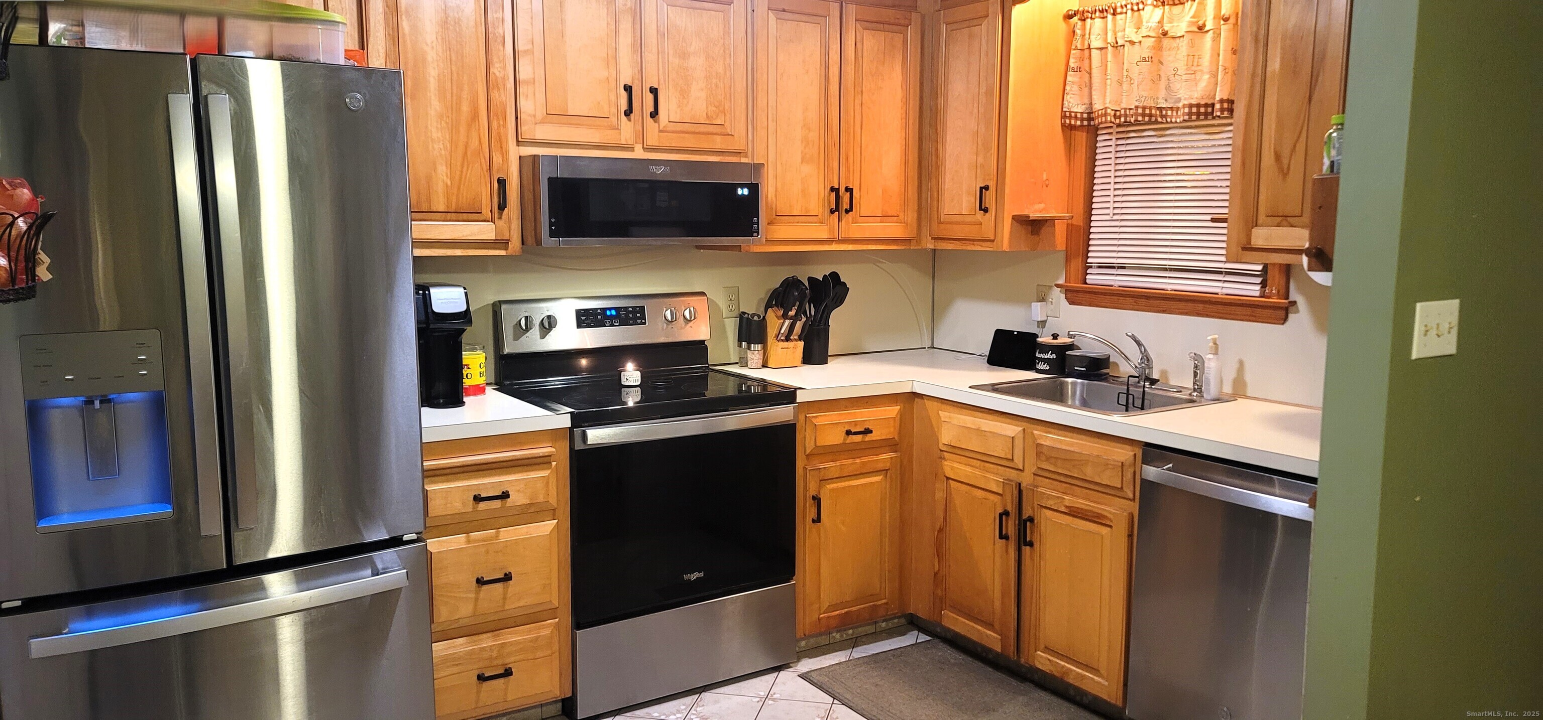 40 South Street, Unit 25 Bristol, CT 06010 - Photo 3 of 24 a kitchen with stainless steel appliances granite countertop a refrigerator a sink and a stove
